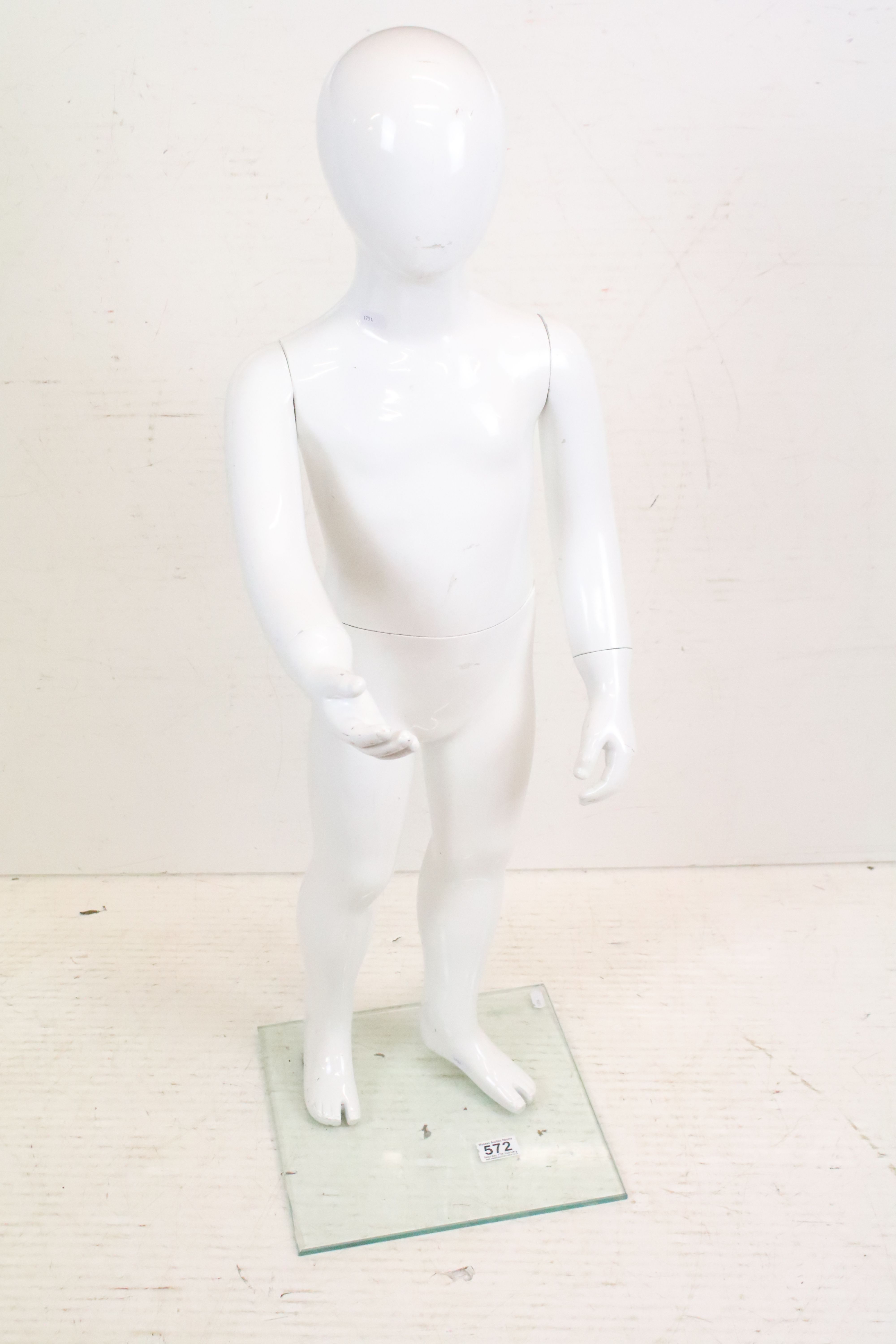 Child Full Size Shop Display Mannequin with plain white finish held on a clear square glass stand,
