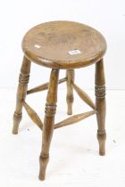 Victorian elm Windsor kitchen stool with rounded and dished seat, 33cm wide x 53cm high