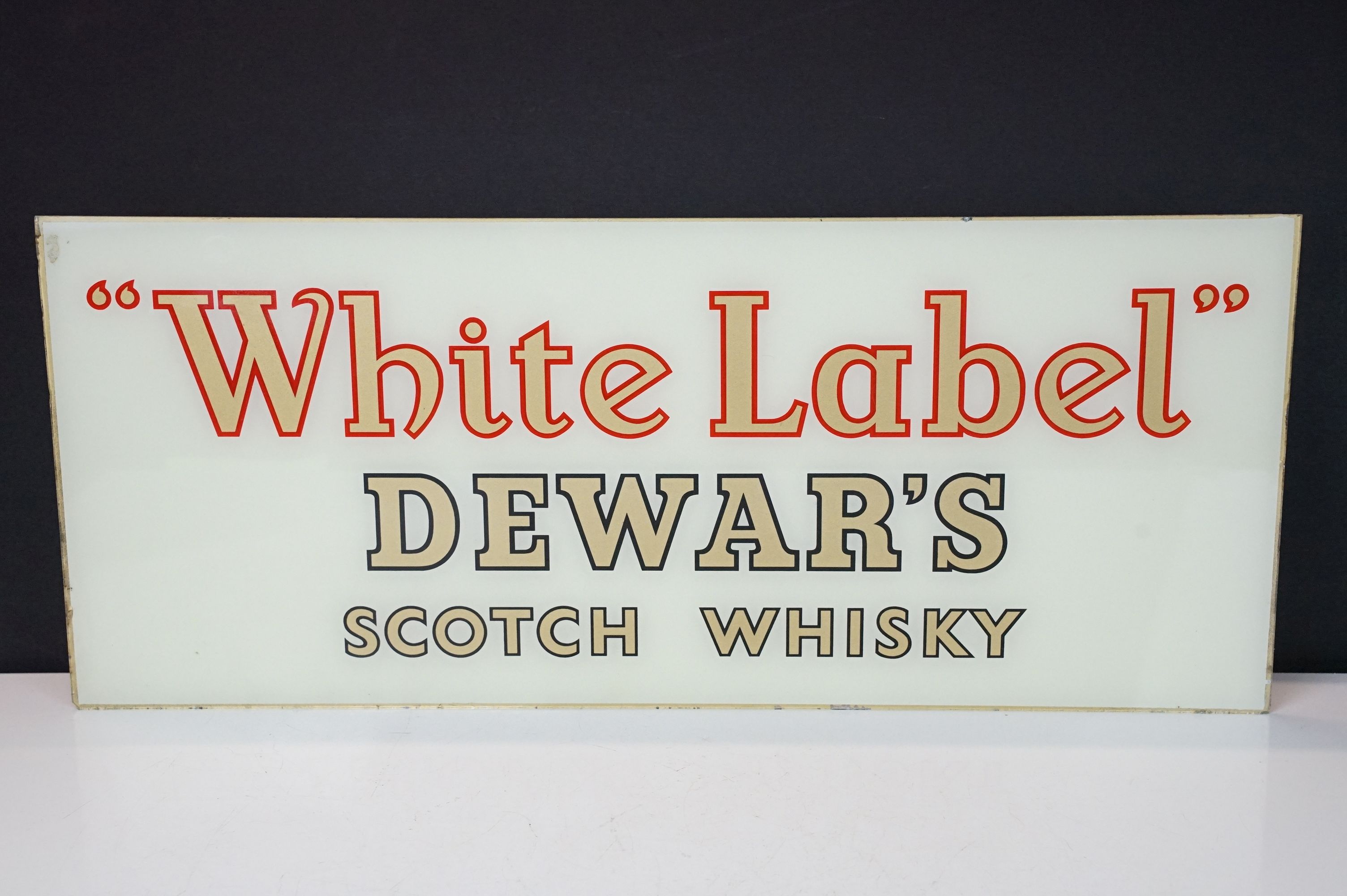 Vintage reverse printed glass "White Label" Dewar's Scotch Whisky sign having gilt lettering on a