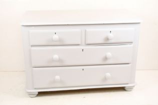 Painted Pine Chest of Two Short over Two Long Drawers raised on bun feet, 104cm wide x 46cm deep x