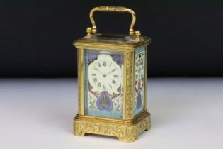 A French miniature carriage clocks with decorative enamel panels and dial, brass cased with