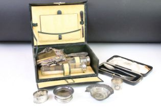 A vintage travelling vanity case complete with contents together with a selection of hallmarked