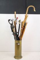 Collection of wooden walking sticks to include an ebonised example with brass horse head handle