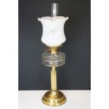 19th Century Victorian oil lamp having a fluted brass base, faceted glass reservoir, with fanned rim