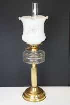 19th Century Victorian oil lamp having a fluted brass base, faceted glass reservoir, with fanned rim
