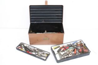 A vintage metal tool box complete with mixed tools to include vices, wrenches....etc.