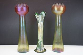 Pair of Art Nouveau iridescent glass vases, in the manner of Loetz, with crimped bulbous tops raised