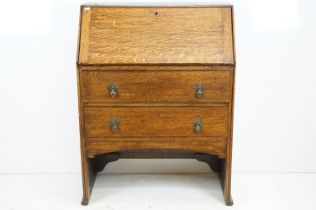 Early 20th century Oak Bureau, the fall front opening to a fitted interior, with two drawers