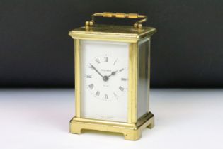 A French Bayard brass cased carriage clock with beveled glass panels.