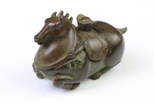 A Chinese copper writing brush / pen washer statue in the form of a horse, removable lid, measures