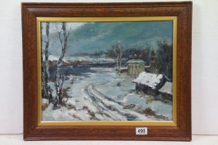 Russian School, oil on board, a snow clad river and country landscape with dwellings, having Russian