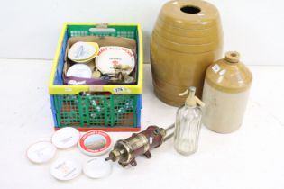 A group of mixed brewery collectables to include advertising ashtrays, bottle pourers, keg taps,