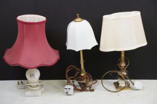 A collection of three table lamps to include two brass examples.