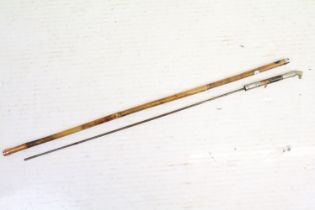 A vintage cane sword stick with horse head pommel.