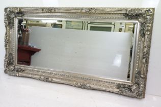 Large Contemporary Mirror with silvered foliage moulded frame and bevelled edge, 176cm x 90cm