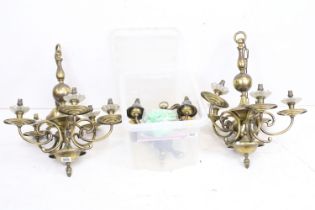 A pair of brass five branch ceiling lights together with two pairs of two branch wall lights.