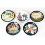 Group of five Moorcroft pottery pin dishes with tubelined decoration, to include 1897-1997