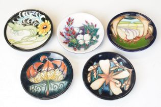 Group of five Moorcroft pottery pin dishes with tubelined decoration, to include 1897-1997