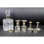 A collection of mixed sterling silver to include a pair of bud vases, pair of candlesticks, vanity