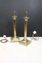 Pair of brass neo classical lamp bases having reeded columns with square bases and Corinthian