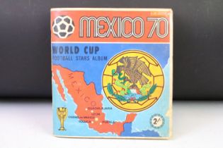 A Panini Mexico Wolrd Cup 1970 sticker album, near complete with some not stuck to album pages.