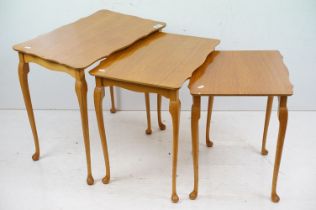 Nest of Three Teak Table with shaped tops and cabriole legs, largest 56cm wide x 54cm high