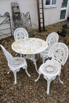 White painted cast metal patio table with four matching chairs, table approx 65cm high