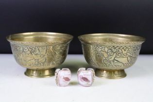 Pair of Chinese brass footed bowls each with incised warrior decoration to the sides and with Xuande