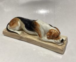 Royal Worcester model of a Hound Dog modelled by Doris Lindner no. 2998, puce marks to base