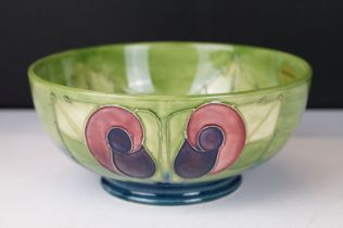 Moorcroft pottery green ground bowl, of circular form, with tubelined floral decoration, Moorcroft