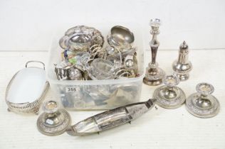 A collection of mixed silver plate to include toast rack, candlesticks, sugar shaker, salts....etc..