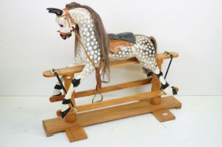 Wooden Painted Dapple Grey Rocking Horse with leather bridle and saddle held on a pine treadle base,