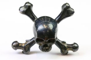 A designer 'Stephen Einhorn' Gothic Skull corkscrew, blackened brass head with red crystal eyes,