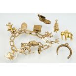 9ct gold charm bracelet having a square link bracelet chain with eight hallmarked 9ct gold charms.