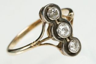 Early 20th Century 18ct gold and diamond three stone ring. The ring being set with three round