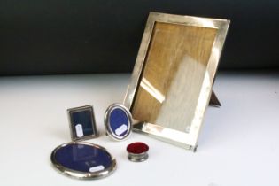 Group of silver fronted photo frames to include a large rectangular example, two oval frames (one