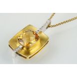 18ct citrine and diamond pendant necklace being set with a rectangular harlequin cut citrine in a