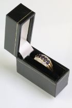 Hallmarked 9ct gold purple stone and diamond ring. The ring being set with five oval cut purple