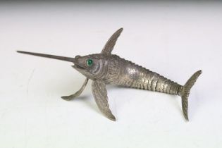 Spanish silver model swordfish having an articulated body with green stone cabochon eyes.