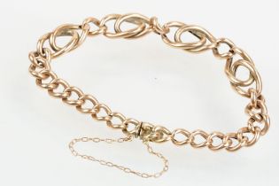 Victorian 9ct rose gold bracelet having curb and fancy links with tongue in groove clasp. Marked