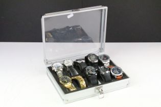 A collection of ten contemporary automatic and quartz wristwatches contained within a display case