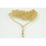 14ct gold modern long guard necklace chain having a heart terminal with screw action dog lead clasp.