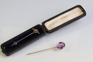 Late 19th Century Victorian amethyst and gold stick pin being set with a large oval mixed cut