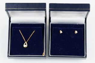 18ct gold and diamond necklace and earrings demi parure suite. The necklace having a find flat