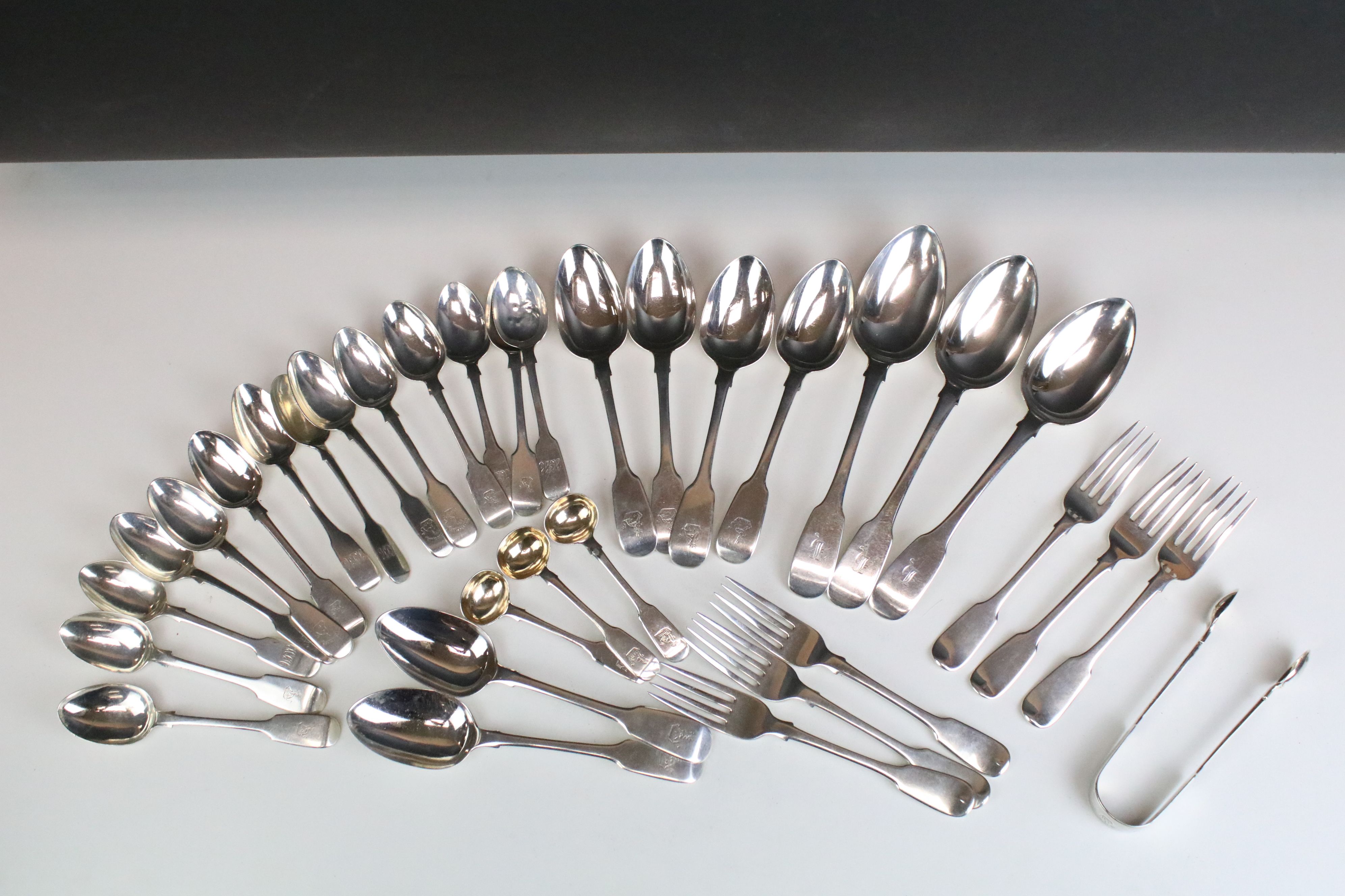 Collection of silver fiddle pattern flatware, mostly Victorian, to include dessert spoons, dessert