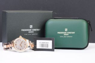 A ladies Frederique Constant Geneve smart watch, bi metal case and strap with roman numeral markers,