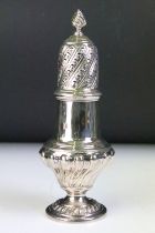 19th Century Victorian silver hallmarked sugar shaker of reeded baluster form with pierced lid.