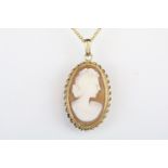 Hallmarked 9ct gold cameo pendant with carved shell cameo, mounted to a 9ct gold chain. Pendant