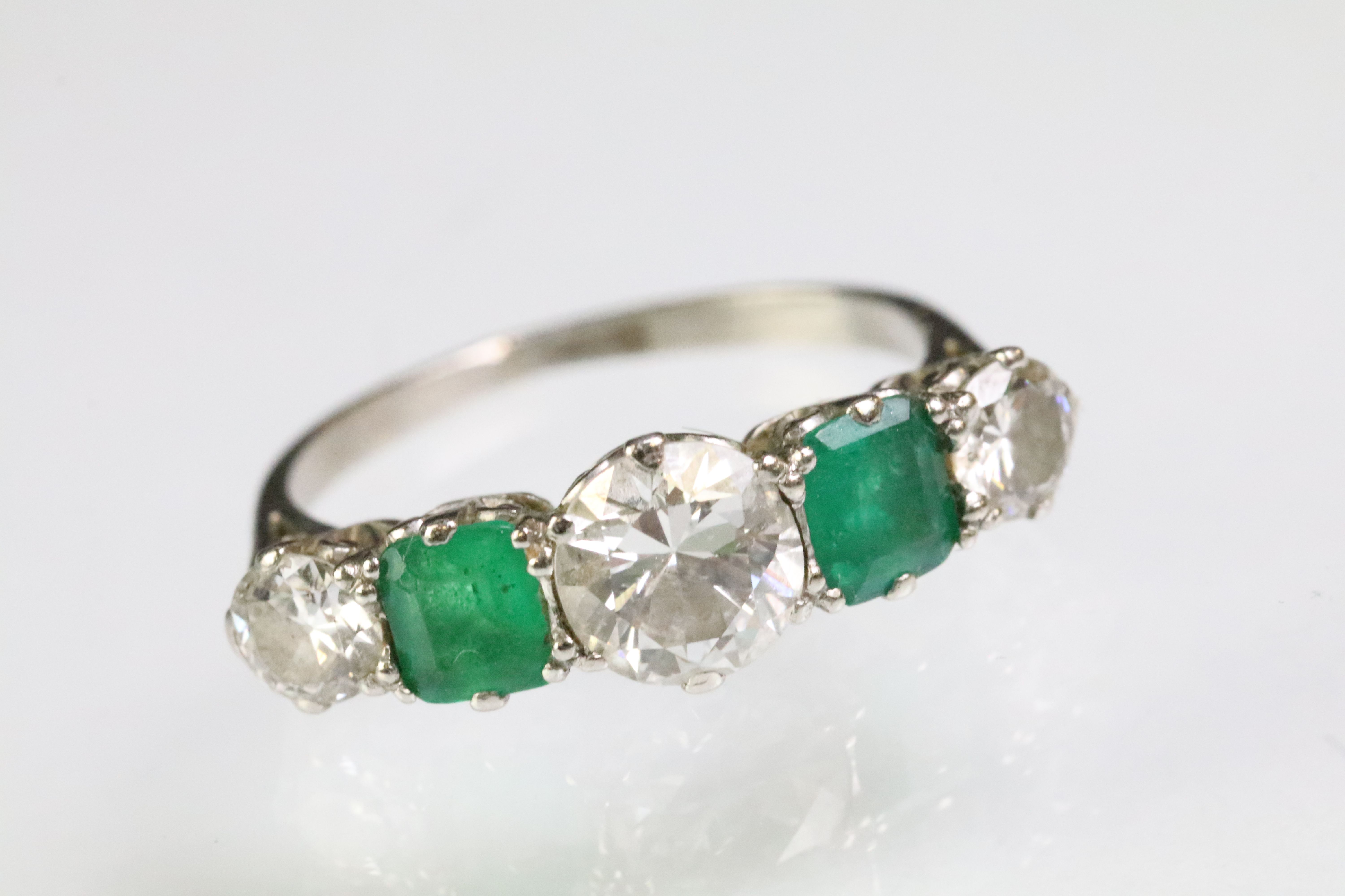 Diamond and emerald five stone ring being set with a round cut diamond to the centre flanked by - Image 2 of 10