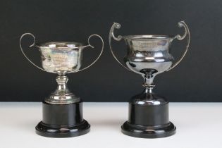 Two silver hallmarked trophies raised on black plastic plinth bases (hallmarked Sheffield 1963,